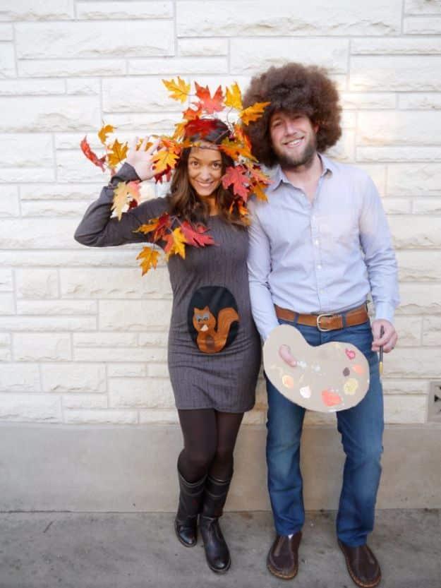 Bob Ross and happy little tree couples costume with a curly wig, denim shirt, paint palette and felt leaves