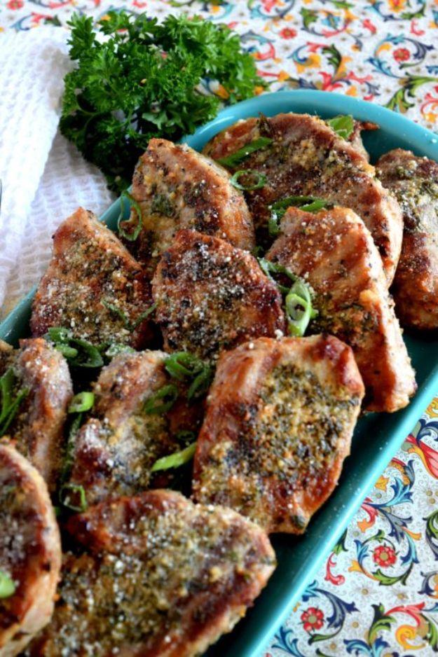 Garlicky butter chive parmesan chops flecked with dried herbs and piled in a teal floral serving dish