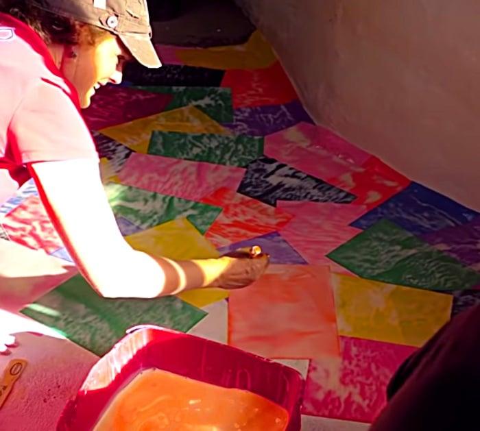 Make a colored paper floor with construction paper from the craft store