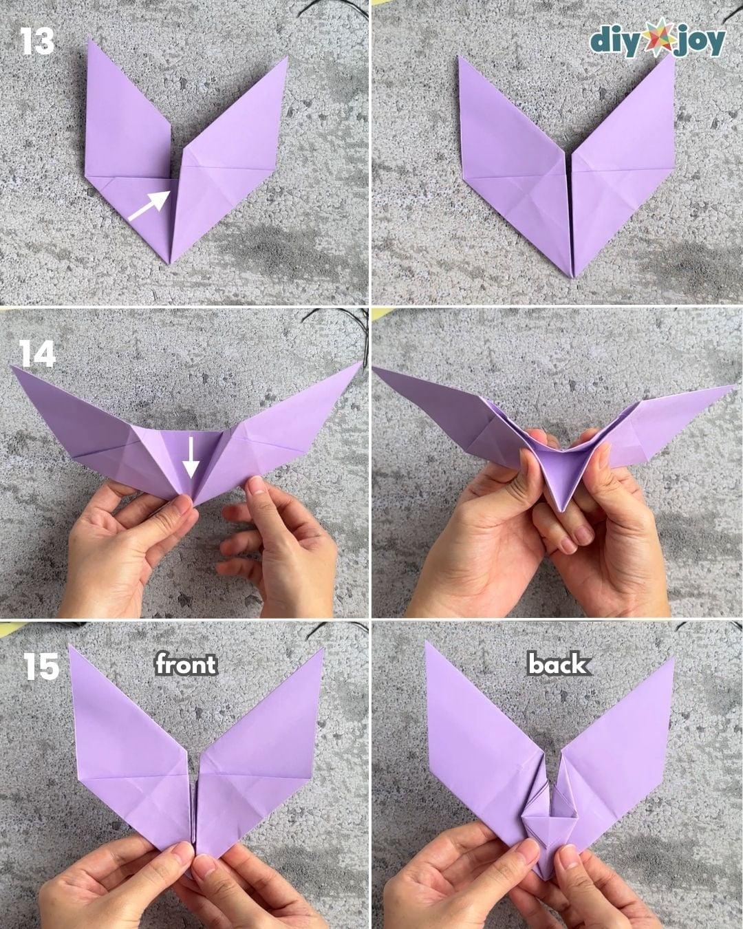 DIY paper bat step 5, folding the bottom edge up to the crease, an easy Halloween craft for kids with no glue needed.