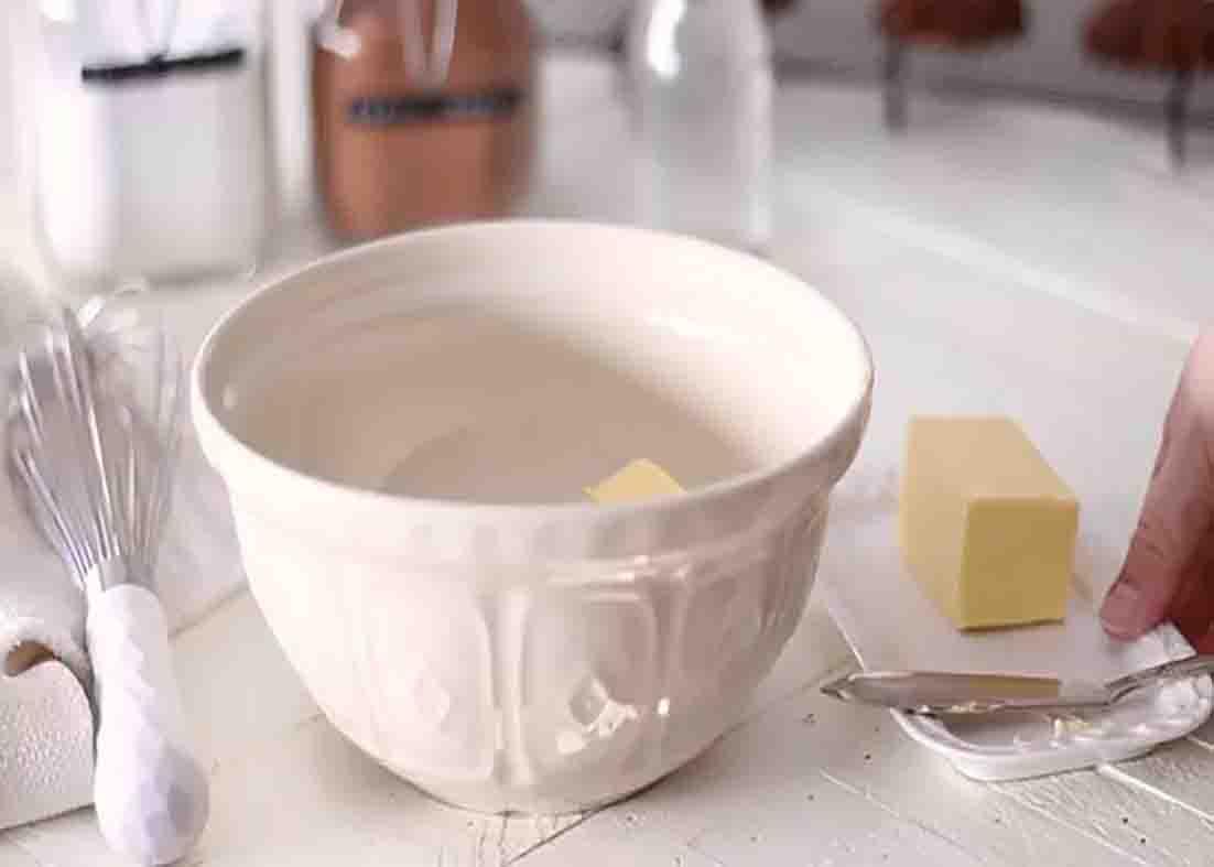 Adding the butter to the chocolate frosting mixture