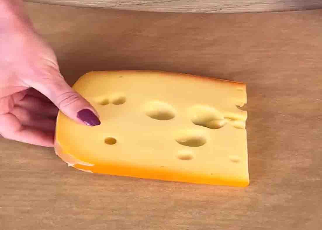 Storing the cheese by wrapping it with parchment paper
