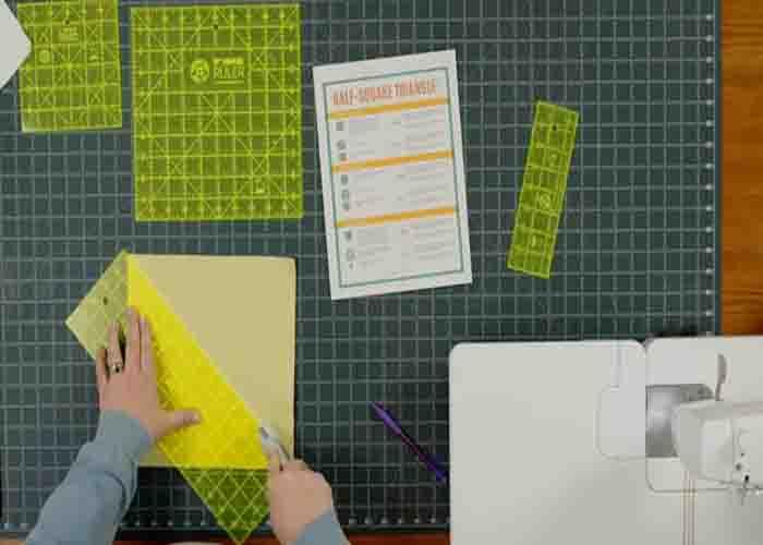 Cutting the square to make half-square triangles for the chevron quilt