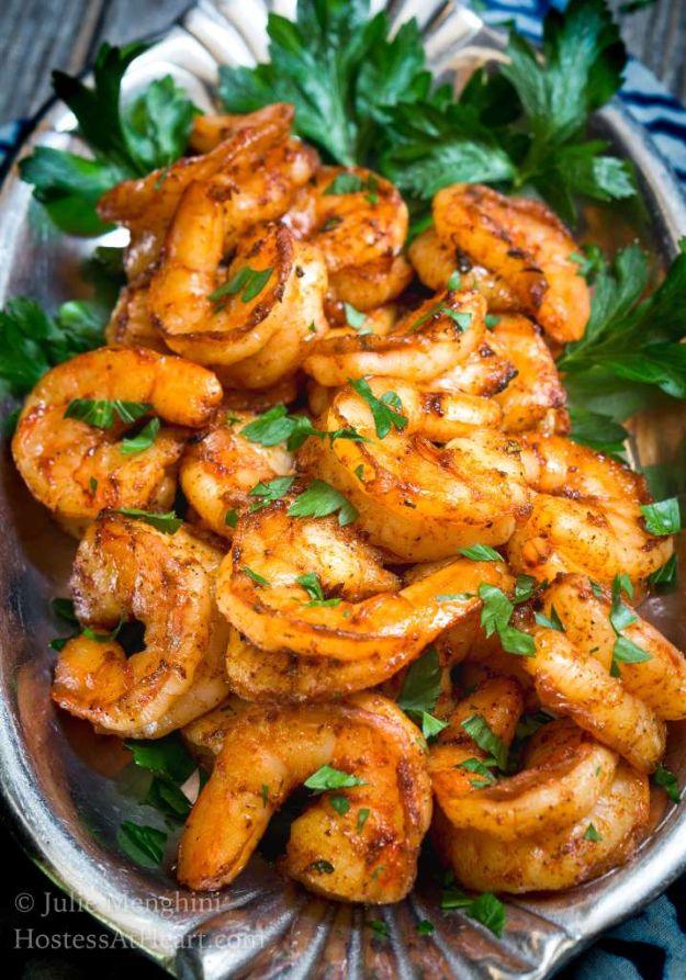 Sensational blackened shrimp on a silver plate with fresh parsley, deep red spiced shrimp curled together