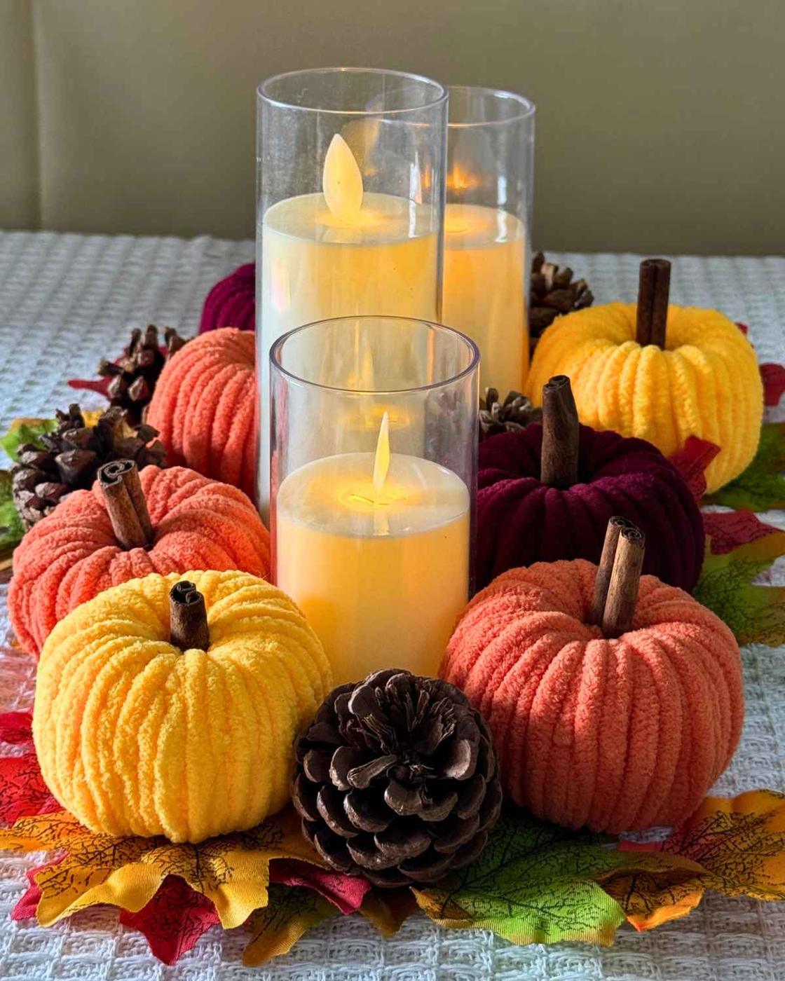 Fall Craft Ideas - close-up of a chenille yarn pumpkin's plush texture and cinnamon stick stem detail.