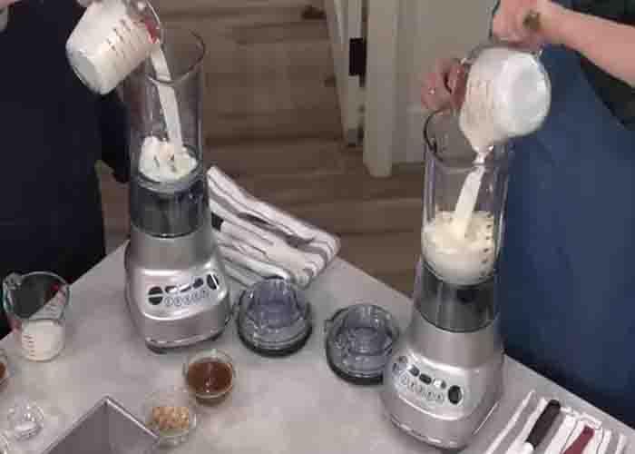 Adding the milk into the blender to make ice cream