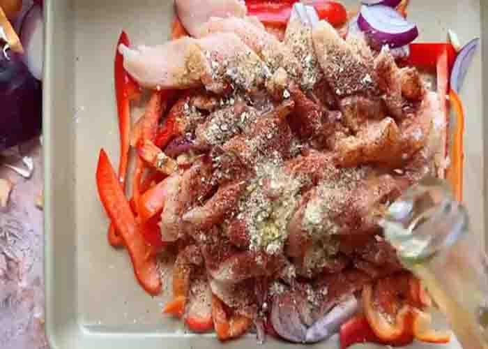 Seasoning the chicken fajitas