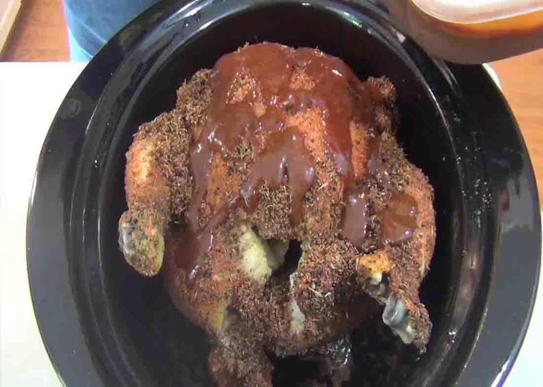 Adding bbq sauce to the crock pot beer can chicken