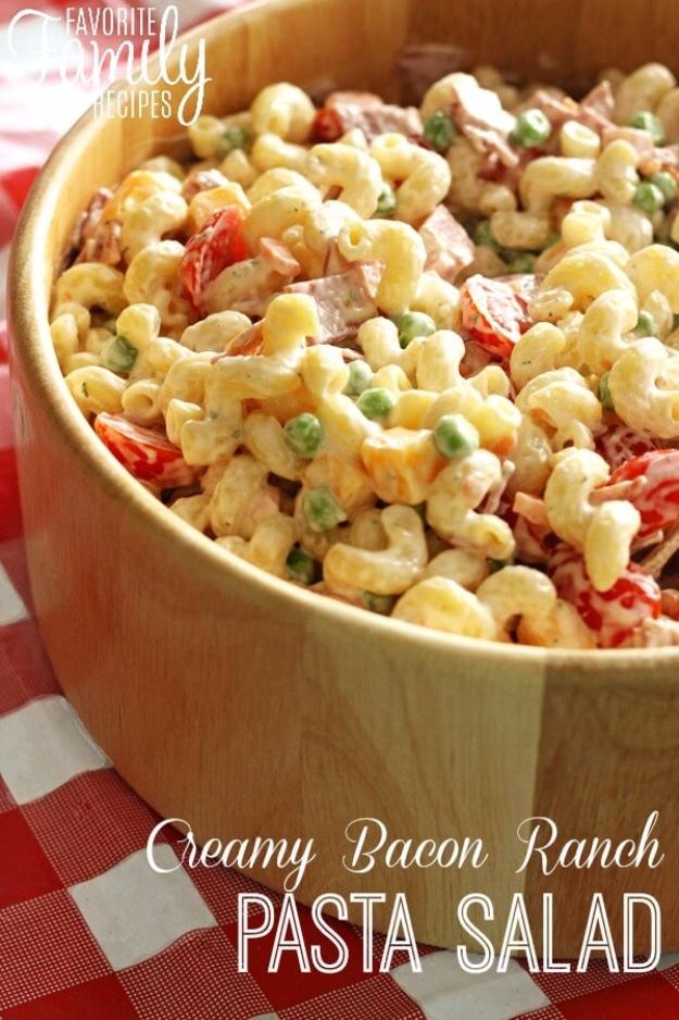 Creamy bacon ranch pasta salad with cavatappi, peas, cubed cheddar, shredded carrot and cherry tomatoes