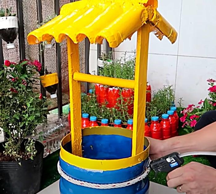 Use a 5 gallon bottle to make a wishing well