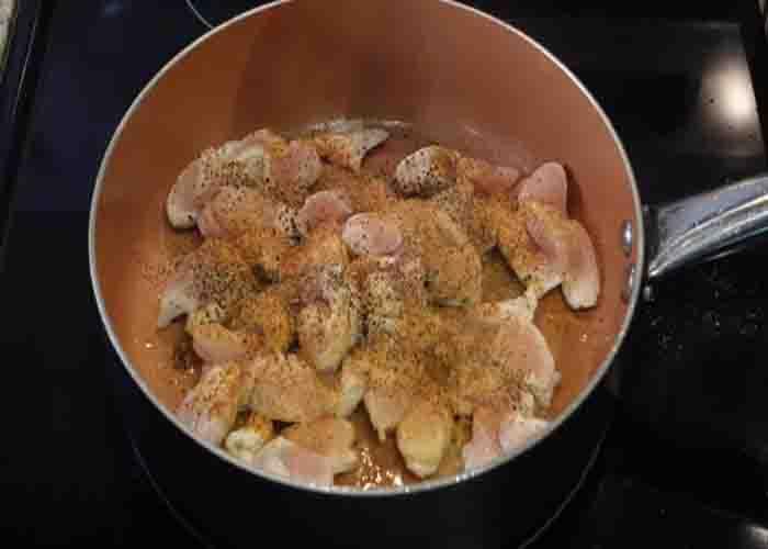Searing the chicken for the broccoli rice casserole