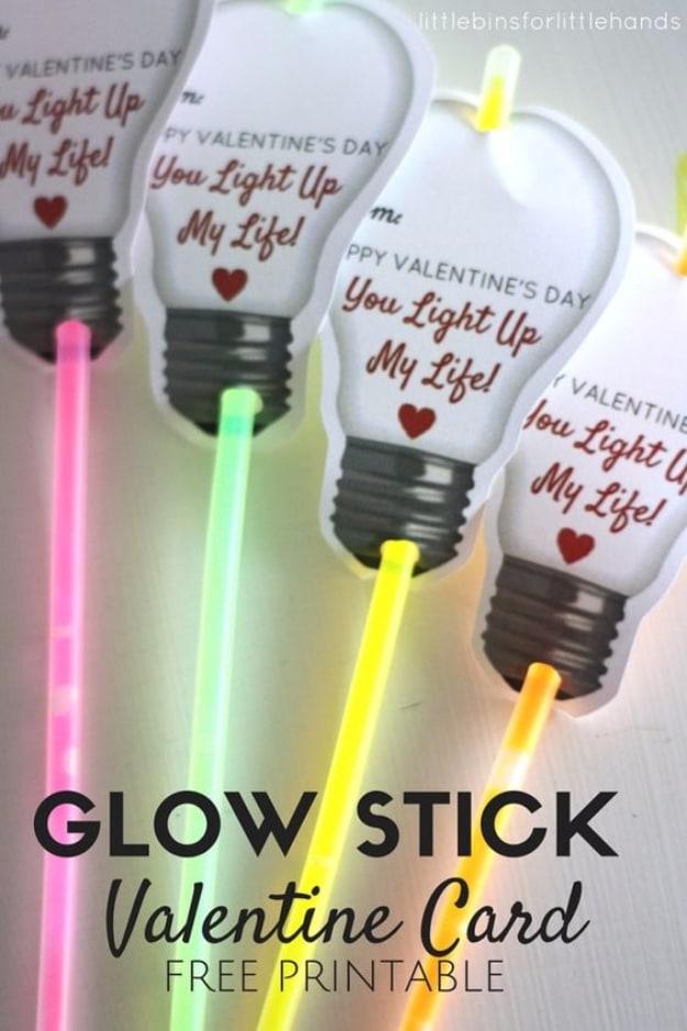 Glow stick Valentine card with a printable light bulb shape and a glow stick threaded through punched holes