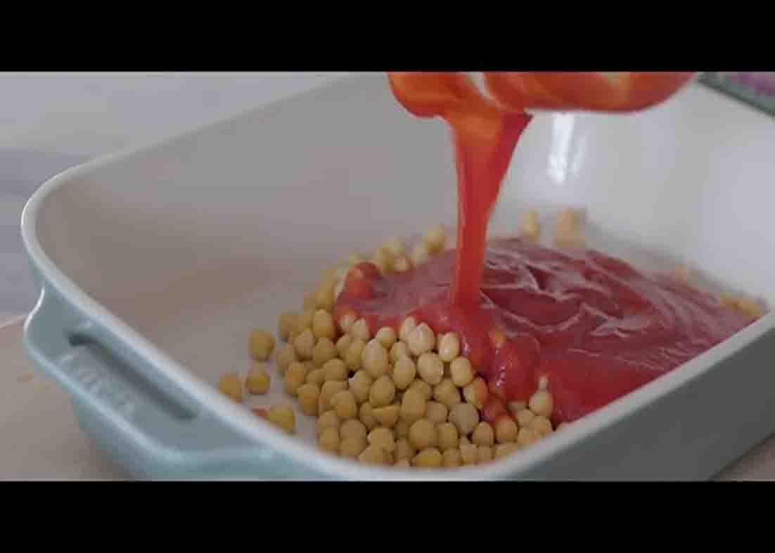 Adding the chickpea on the casserole for the chickpea and vegetable casserole recipe