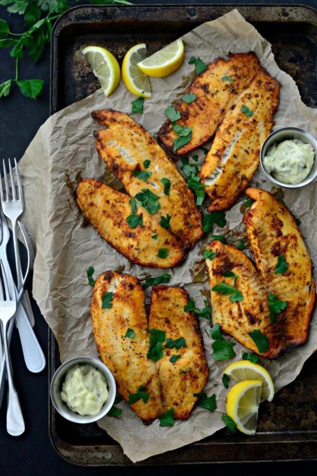 Cajun tilapia with lemon tarragon tartar sauce and lemon wedges, a spicy and easy pan fried fish recipe