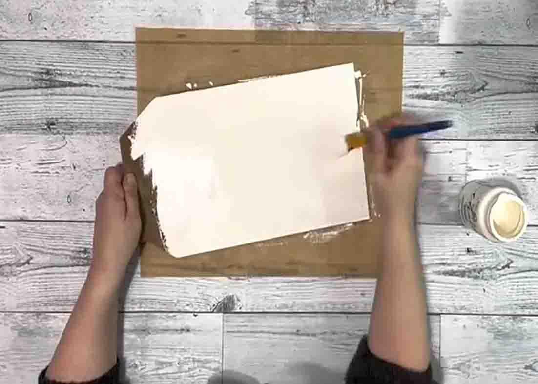 Painting the Dollar Tree tag sign with white chalk paint