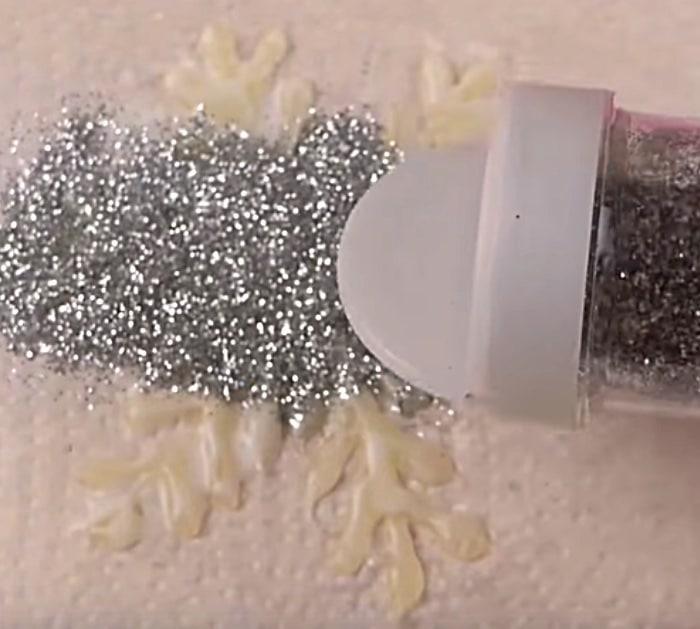 Learn to make a DIY Glue Gun Snowflake With Glitter