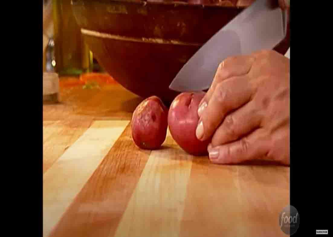 Cutting the potatoes in half