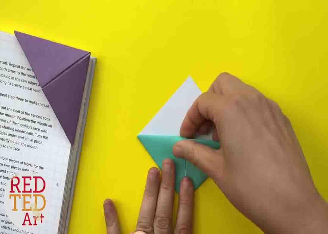 Folding the paper for the origami corner bookmark