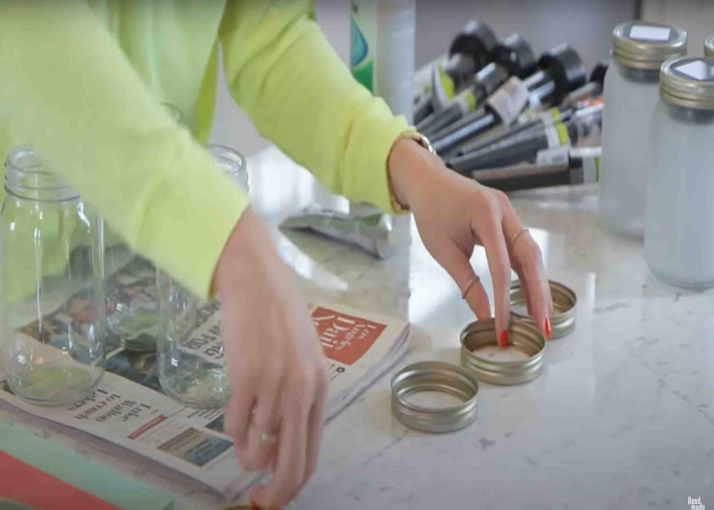 Taking out the lid of the mason jars