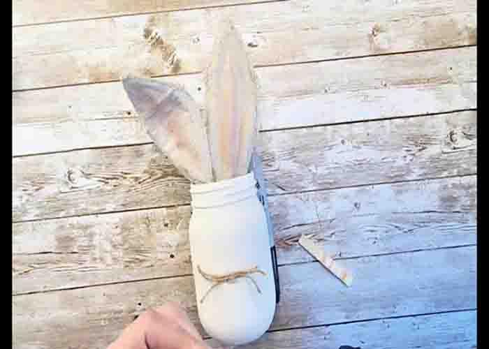 Attaching the bunny ears to the mason jar