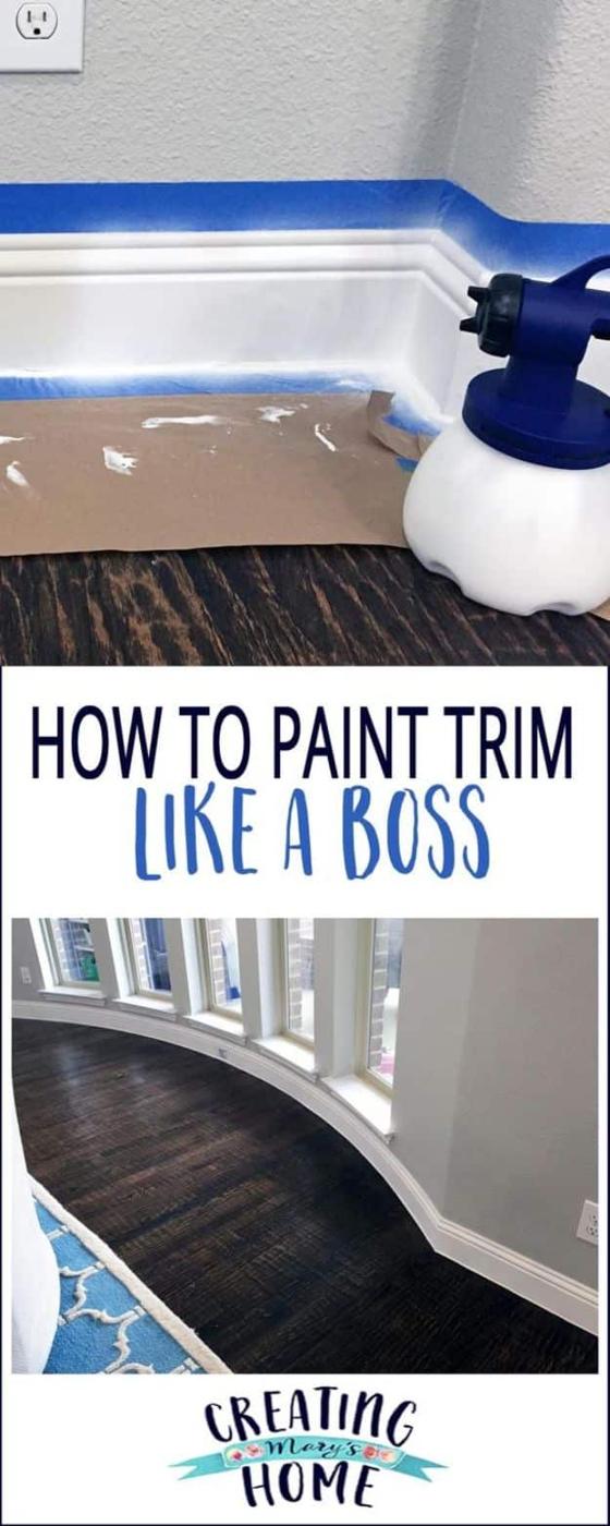 Painting hack for trim, an HVLP paint sprayer beside white baseboards masked with blue tape and brown paper