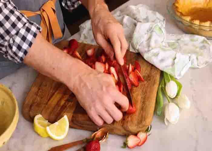 Cutting the strawberries into halves