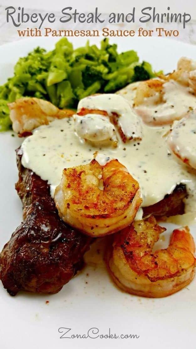 Rib eye steak and shrimp for two, grilled together and topped with a creamy parmesan and fresh basil sauce