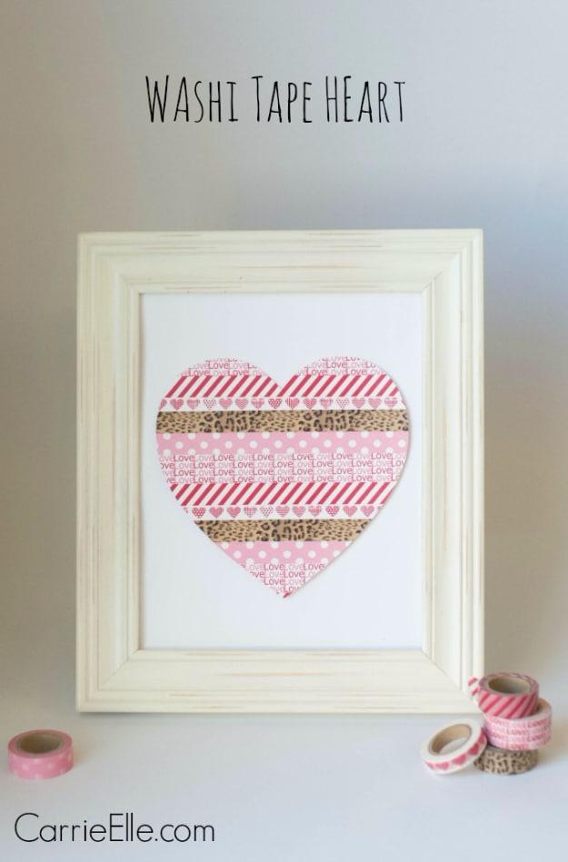 Large heart made from overlapping strips of pink washi tape on a wall, a no damage DIY Valentine decor idea