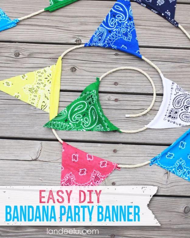 Bandana party banner graphic, pennants in blue, green, pink, yellow, white and navy strung on jute rope