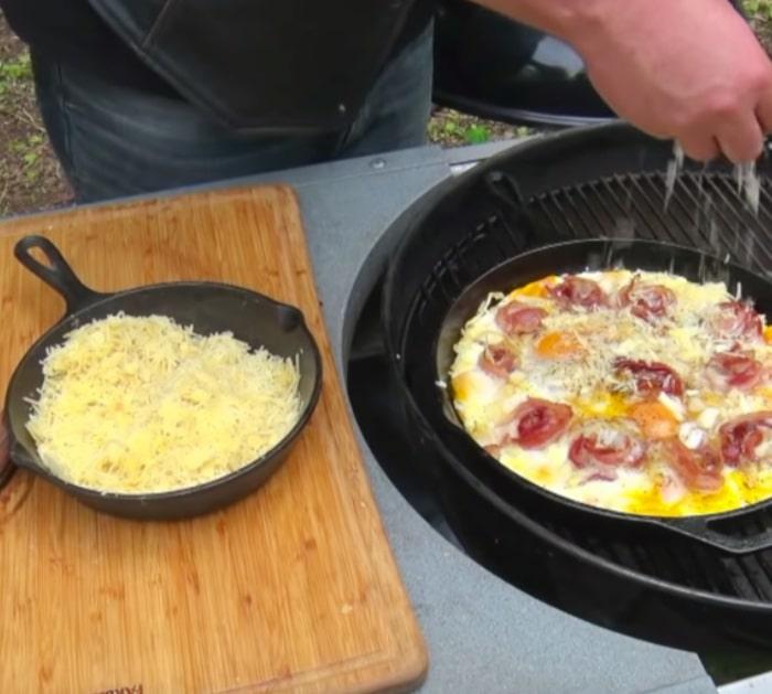 Make Bacon and Eggs Skillet Pie either on the pit or in the oven