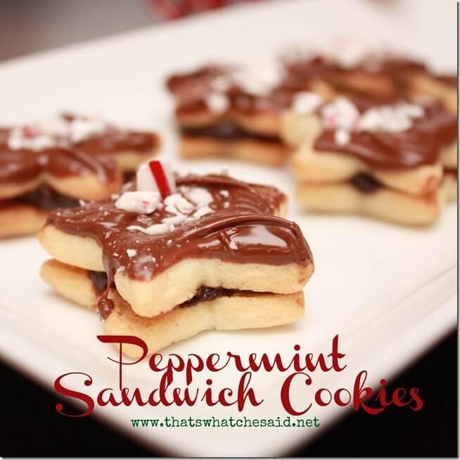 Star shaped sandwich cookies filled with peppermint ganache and topped with melted chocolate and crushed candy cane on white