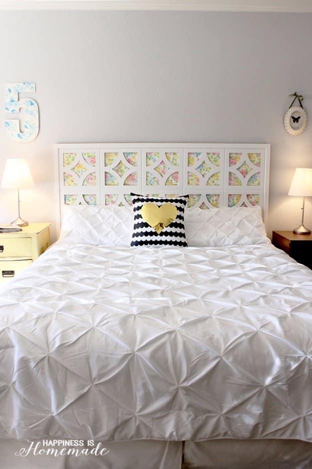 DIY vintage sheet headboard, white framed panels with cut out openings backed by pastel floral vintage sheet