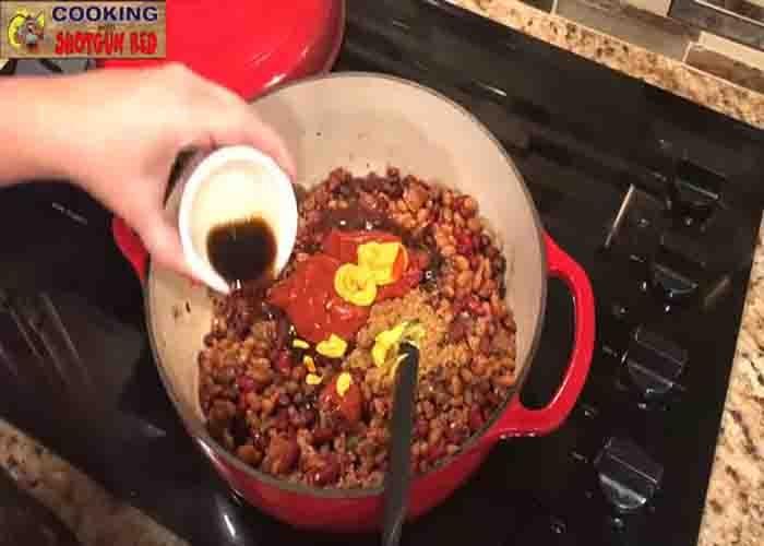 Mixing all the ingredients for the cowboy beans