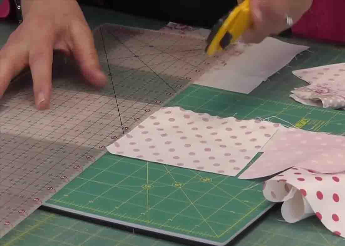Cutting the strip for the falling charms quilt