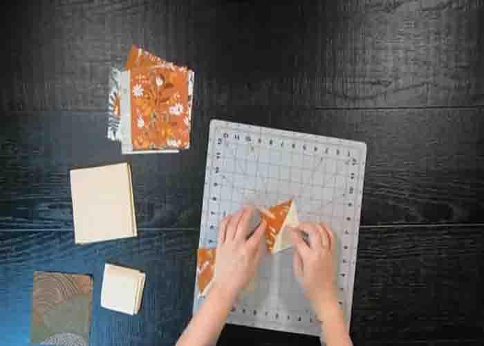 Making the half-square triangles for the tree line table runner quilt