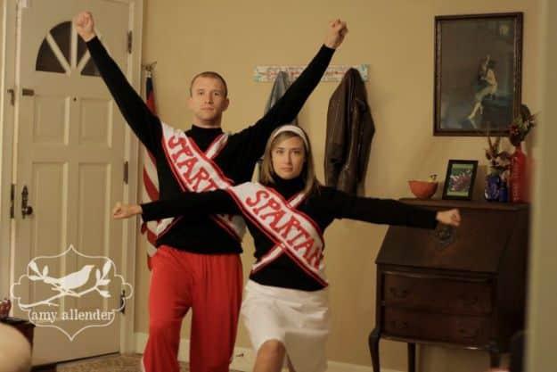 Spartan cheerleaders couples costume with matching school color sweaters, pleated skirts, knee socks and pom poms