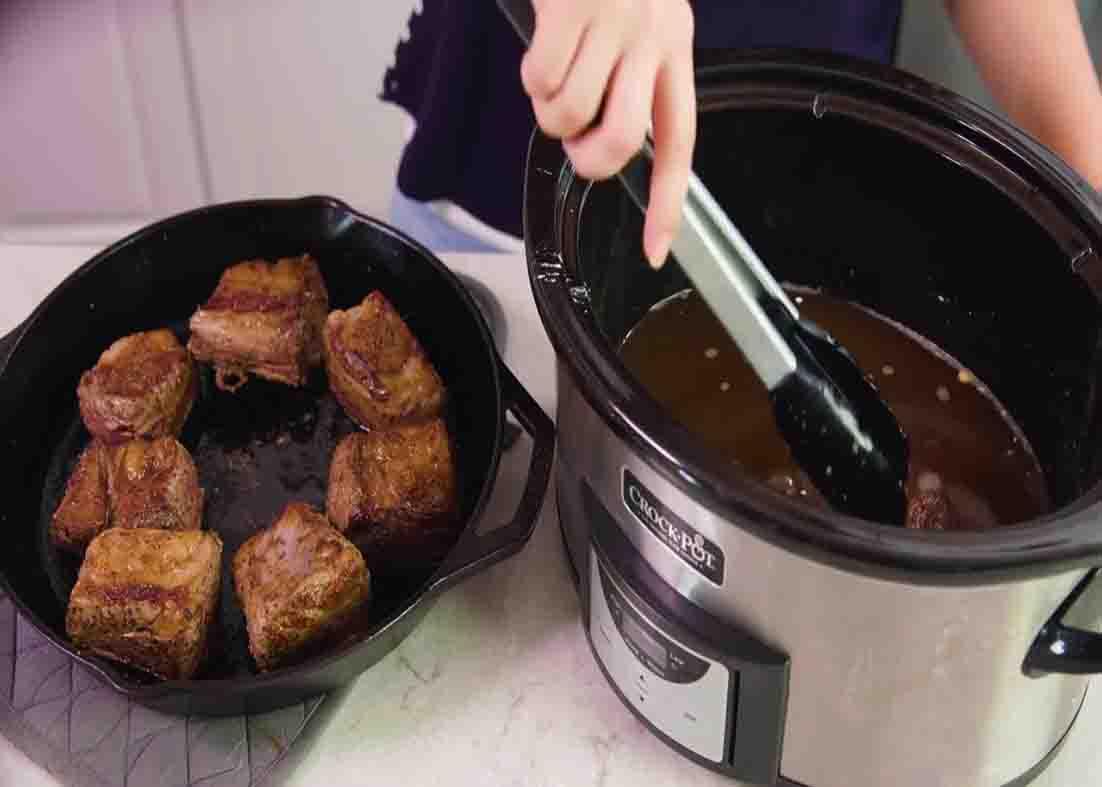 Slow cooking the beef short ribs