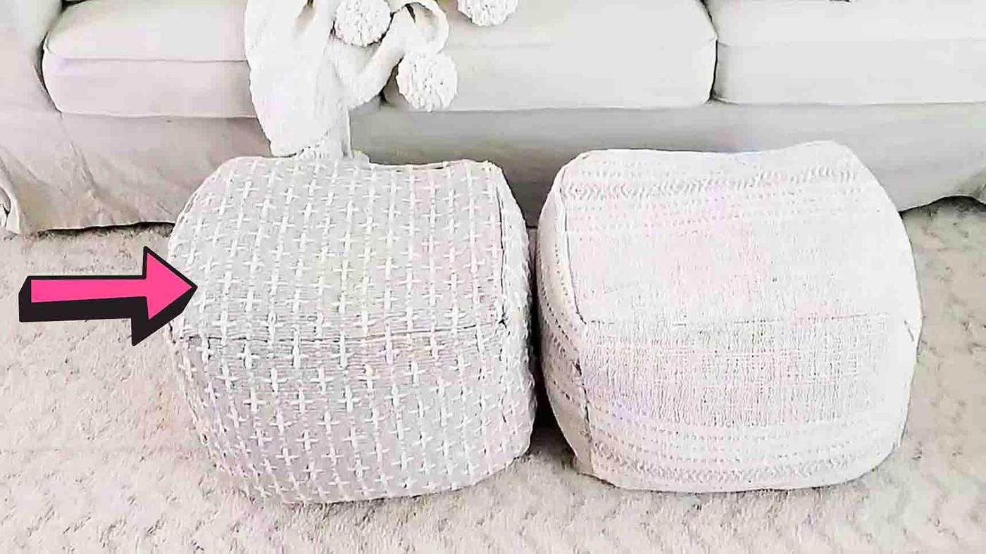 Two cream textured no sew floor poufs made from rugs, sitting on a white shag carpet in front of a white sofa