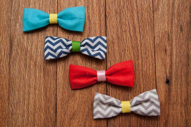 Fabric bows in three sizes on alligator clips, sewn in floral cottons, heaped in a bowl on a craft fair table
