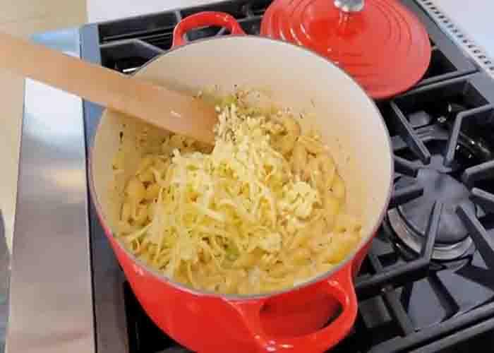 Adding the cheese to the tuna casserole