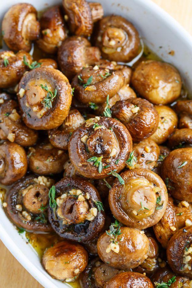 Roasted mushrooms in a browned butter garlic and thyme sauce, glossy and darkly caramelized in a skillet