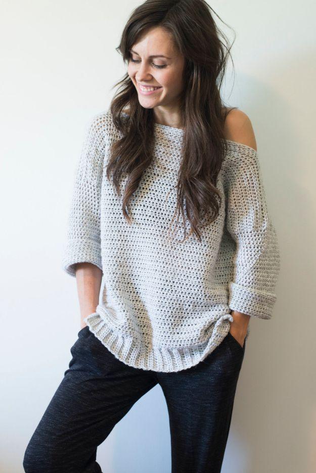 DIY clothes for winter, a woman in an oversized cream crochet sweater with a cold shoulder detail and black jeans