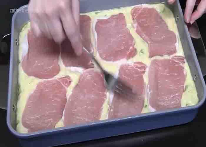 Adding the pork chops to the casserole
