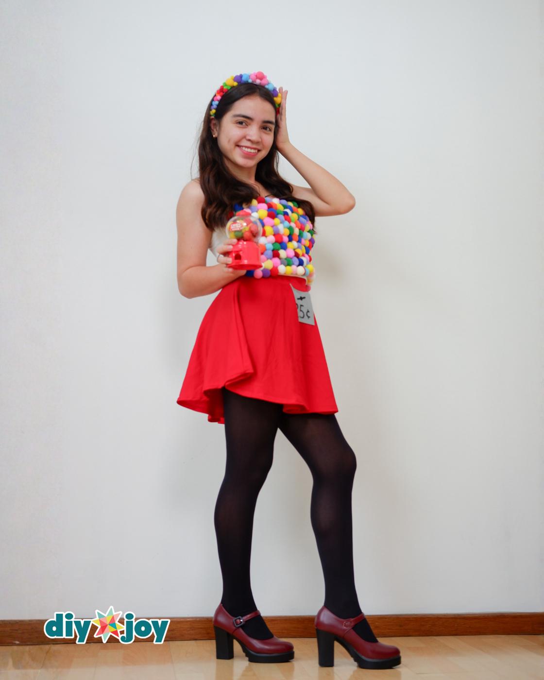 Homemade Costume Ideas - model smiling with her pom pom headband, one of those easy Halloween costumes built at home.