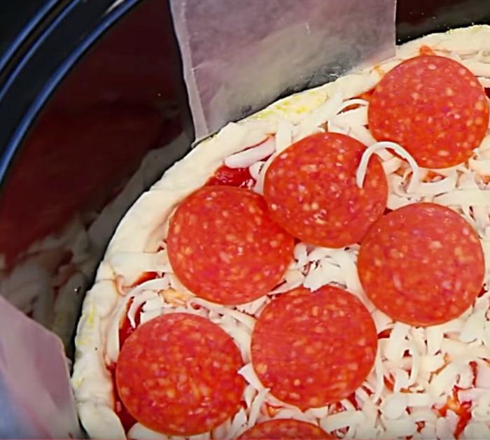 Learn to make this crockpot pizza recipe using pop biscuit dough