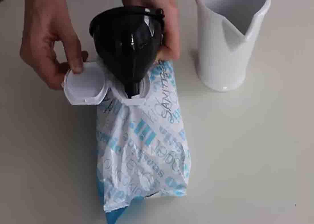 Pouring alcohol inside the wipes to saturate them
