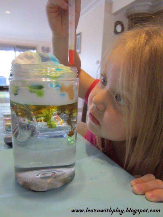 Make cloud jars, a jar of water topped with shaving foam and colored drops falling through, a young child watching close by