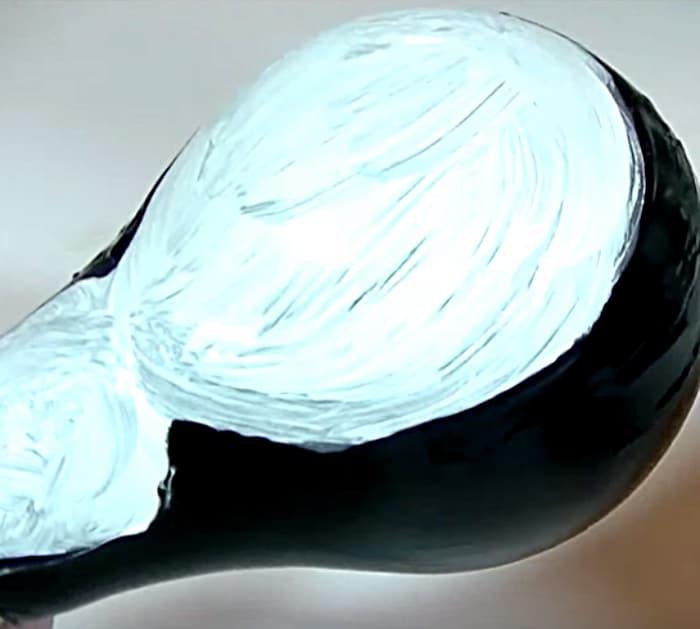 Learn this DIY Penguin Ornament Idea using Light Bulbs and paint