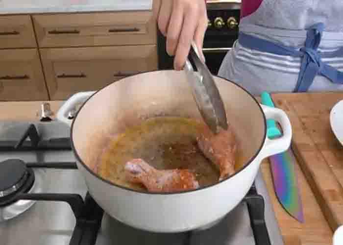 Frying the chicken for the Italian chicken and potatoes recipe