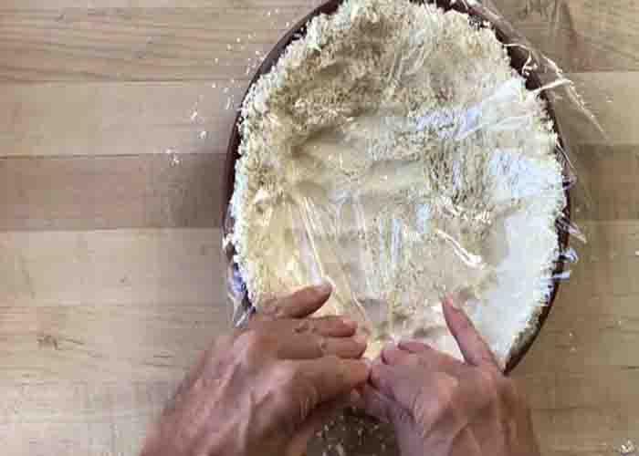 Pressing in the homemade pie crust